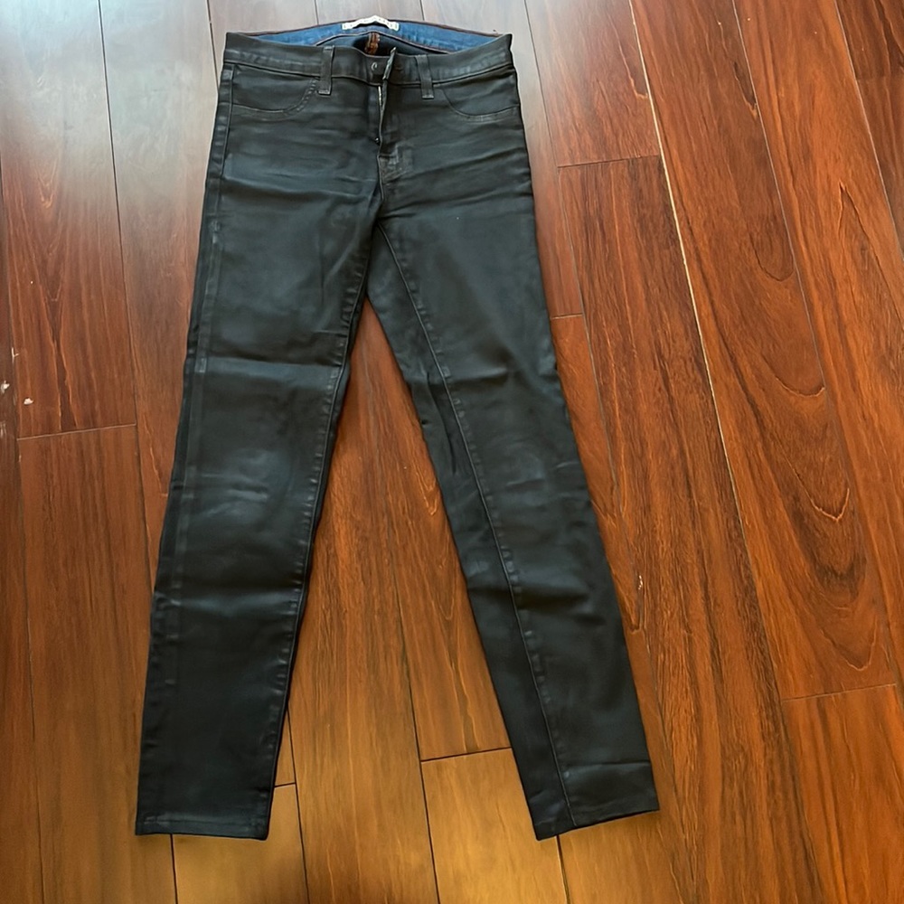 Jbrand jeans, material is waxlike, very dark blue, has shine to it